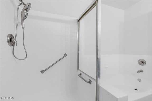 bathroom with shower with separate bathtub