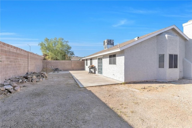 view of yard with a patio area and central AC