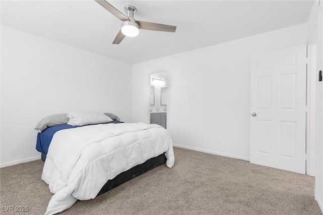 carpeted bedroom featuring connected bathroom and ceiling fan