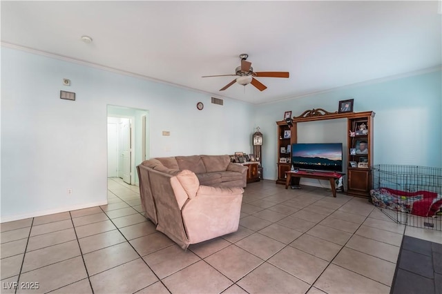 tiled living room featuring ceiling fan and crown molding