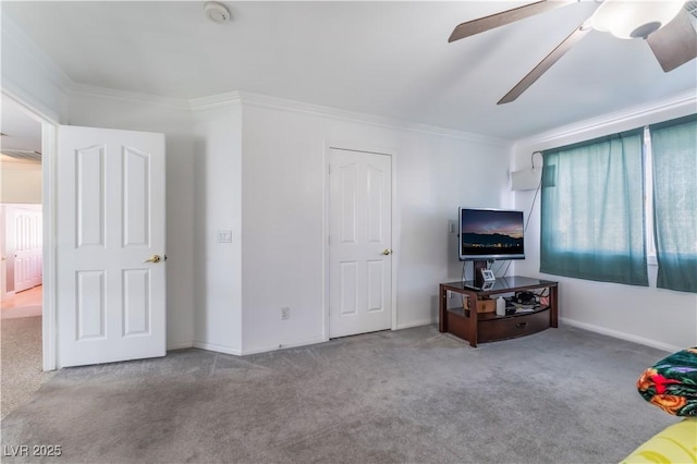 living room with ceiling fan, light carpet, and crown molding