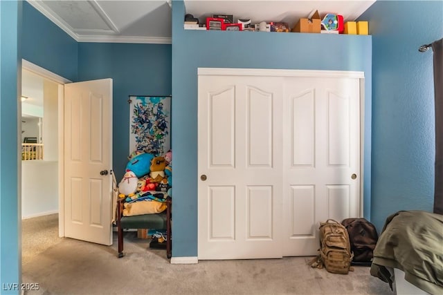 carpeted bedroom with a closet and ornamental molding