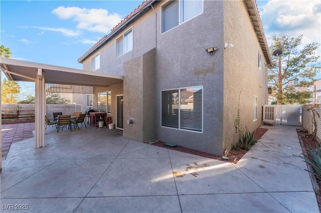 back of property with a patio area