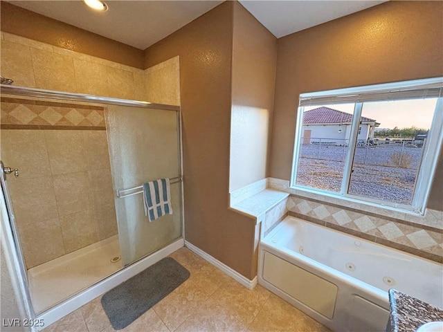 bathroom with independent shower and bath and tile patterned flooring