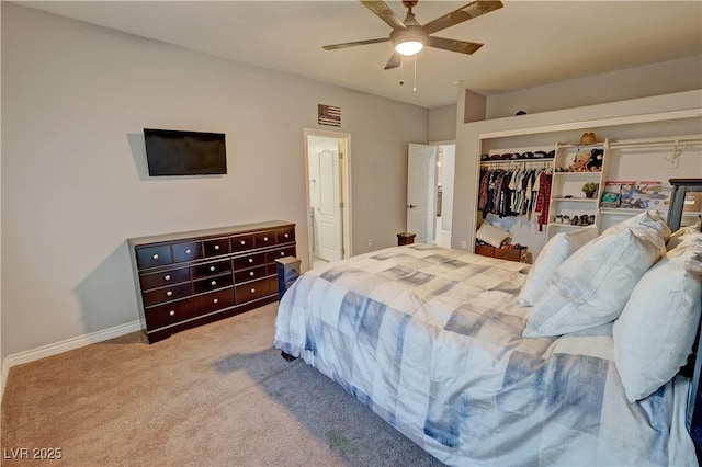 bedroom featuring ceiling fan, a closet, and carpet floors