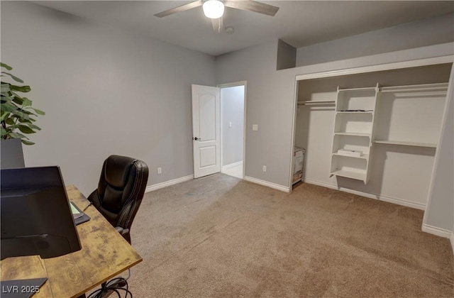 unfurnished office featuring carpet floors and ceiling fan