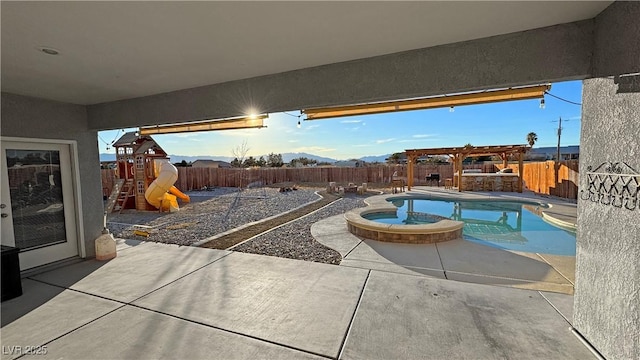 view of swimming pool with a mountain view