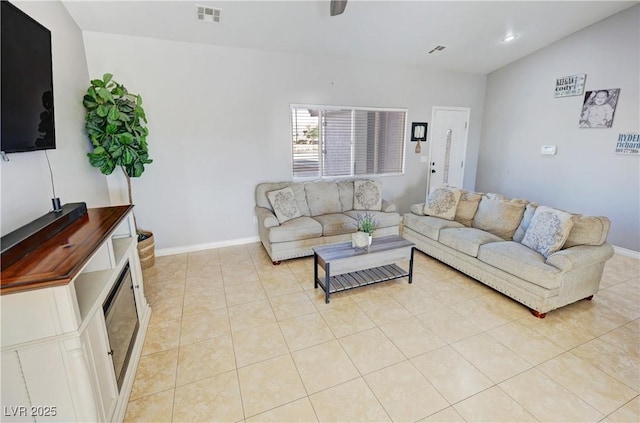 living room featuring light tile patterned floors and lofted ceiling