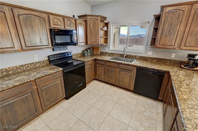 kitchen featuring black appliances, sink, dark stone countertops, and light tile patterned flooring