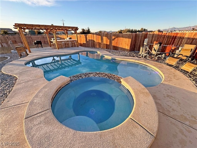 view of pool with exterior bar, a pergola, a patio, and an in ground hot tub