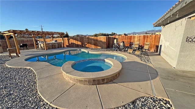 view of pool featuring a pergola, a patio area, and an in ground hot tub