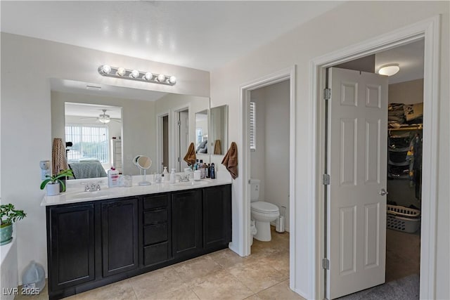 bathroom featuring tile patterned floors, toilet, and vanity