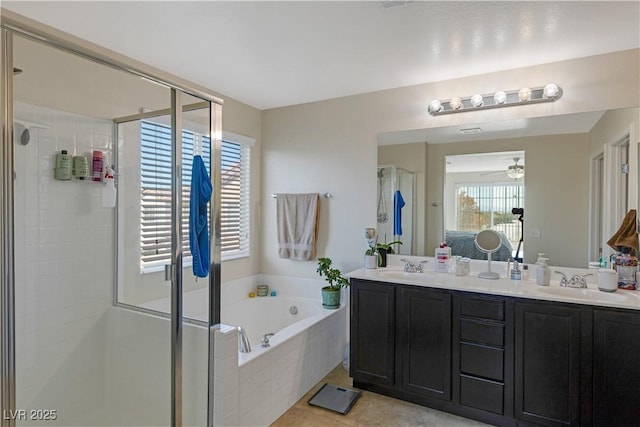 bathroom with vanity, tile patterned flooring, and shower with separate bathtub