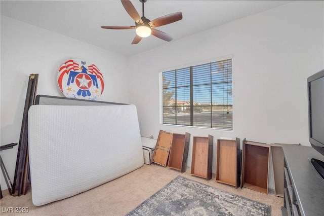 interior space with ceiling fan and light carpet