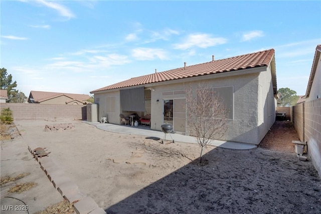 back of house featuring a patio area