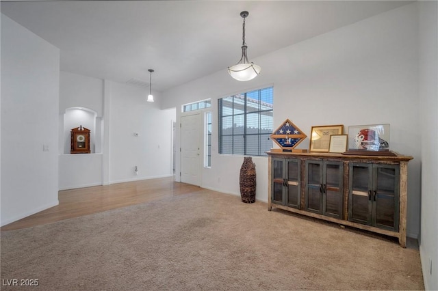 interior space featuring light colored carpet