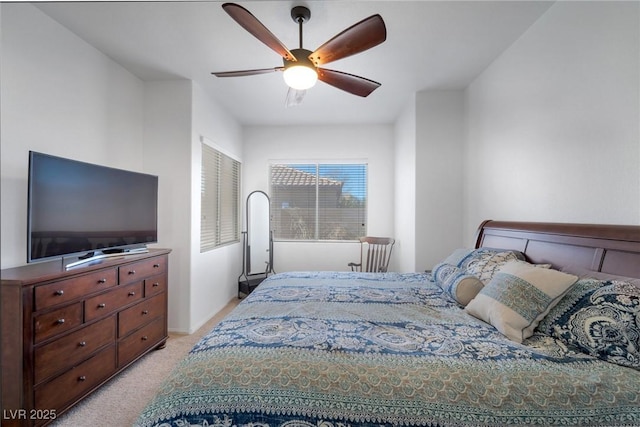 bedroom featuring ceiling fan and light carpet