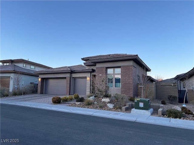 prairie-style home featuring a garage