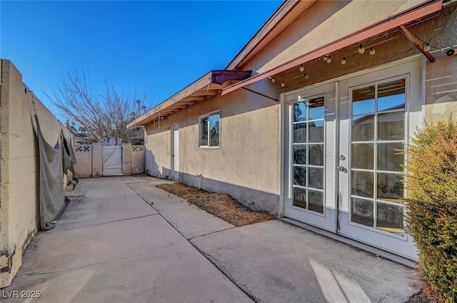 view of side of home with a patio area