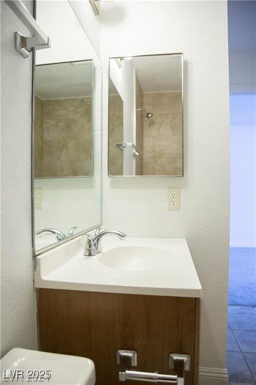 bathroom with toilet and vanity