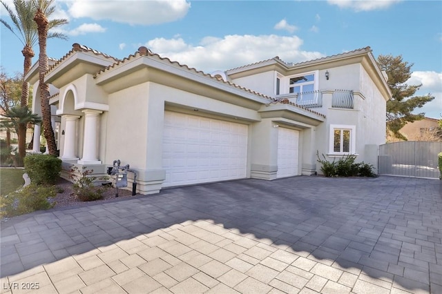 mediterranean / spanish home featuring a garage