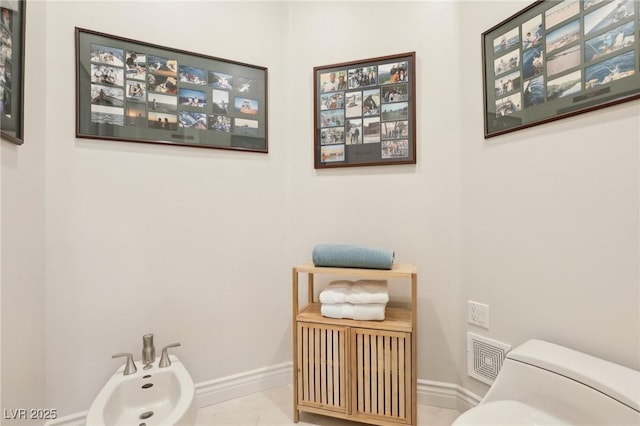 bathroom featuring a bidet and toilet