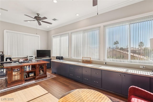 home office featuring ceiling fan, dark hardwood / wood-style flooring, and crown molding