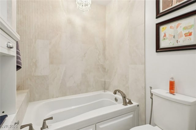 bathroom featuring toilet and a bathing tub