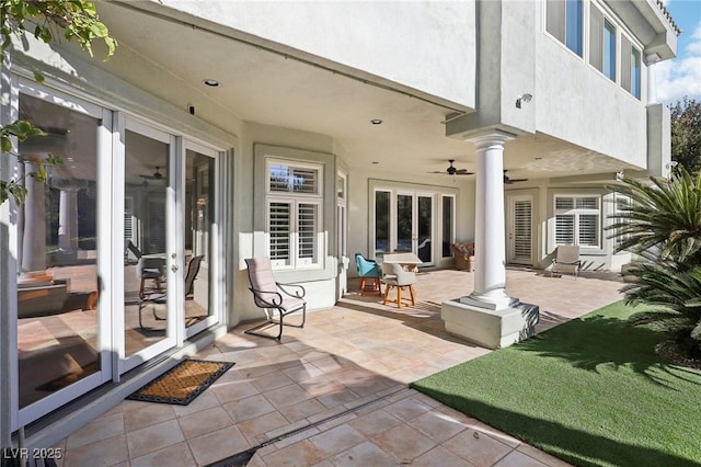 view of patio / terrace featuring ceiling fan and french doors