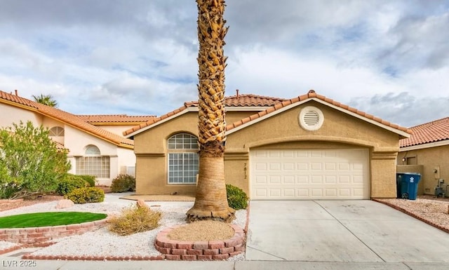 mediterranean / spanish-style home featuring a garage