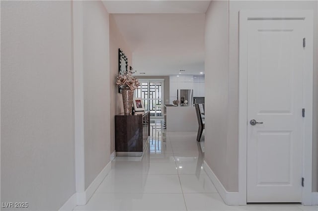 corridor with light tile patterned floors