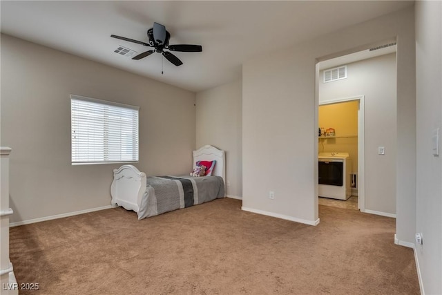 carpeted bedroom with ceiling fan, washer / clothes dryer, and connected bathroom