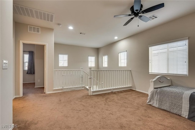 interior space with ceiling fan