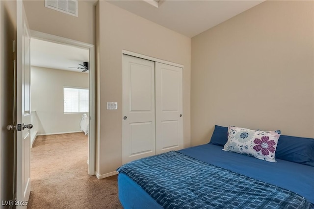 bedroom with carpet floors and a closet