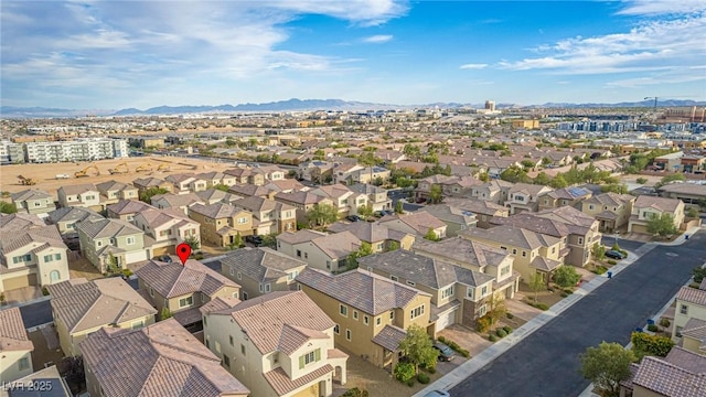 birds eye view of property featuring a mountain view