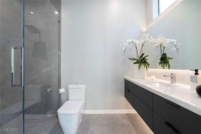 bathroom featuring toilet, vanity, and walk in shower