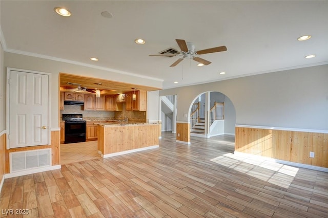 kitchen featuring ceiling fan, light wood-type flooring, crown molding, and black range with electric cooktop