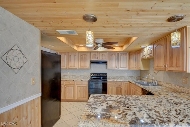 kitchen featuring light brown cabinetry, wood ceiling, a tray ceiling, and black appliances