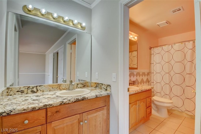 bathroom with curtained shower, toilet, vanity, and tile patterned flooring