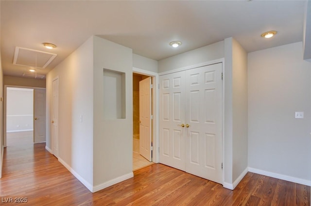 hall with hardwood / wood-style flooring