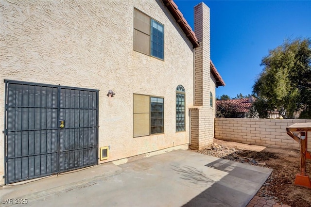 rear view of property featuring a patio