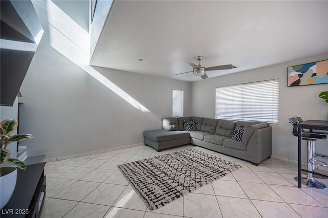 tiled living room with ceiling fan