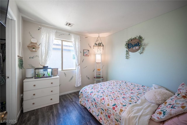 bedroom featuring dark hardwood / wood-style flooring