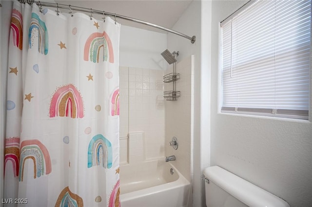 bathroom featuring toilet and shower / tub combo