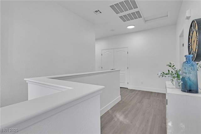 hallway with light wood-type flooring