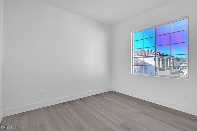 empty room featuring wood-type flooring