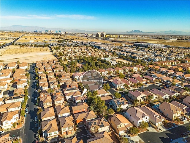 birds eye view of property featuring a mountain view