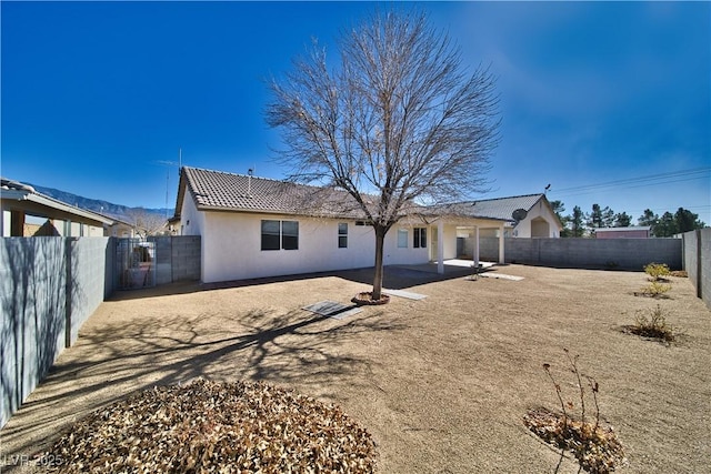 back of house featuring a patio