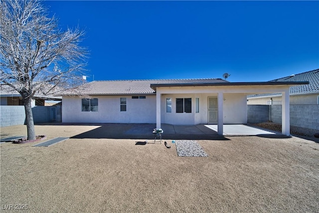 rear view of property with a patio area