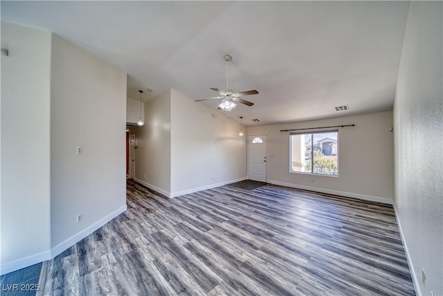 spare room featuring ceiling fan, hardwood / wood-style floors, and lofted ceiling